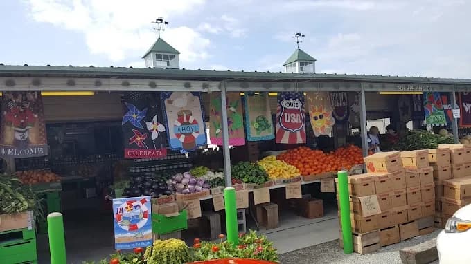 Pole Green Produce stand with seasonal fruits and vegetables
