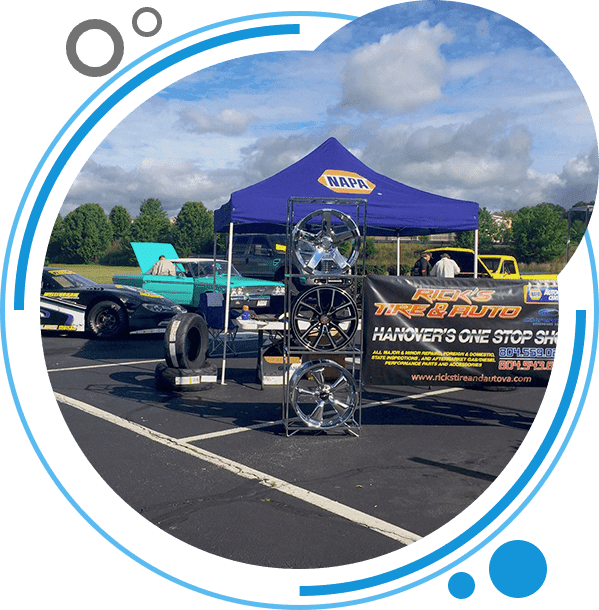 Rick's Tire & Auto vehicle display at an outdoor community event